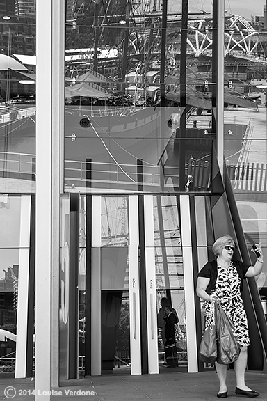 Woman Around a Glass Building