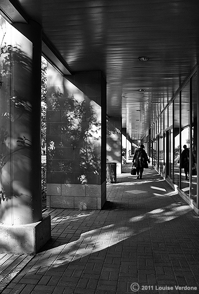 Woman in a Passage Around a Building