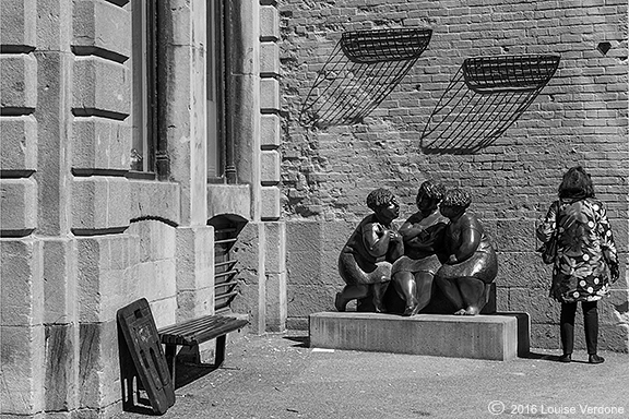 Flower Coat Woman and Sculpture