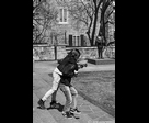 Couple Playing Near a Sculpture