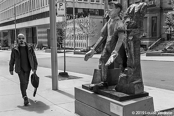 Man with Goatee and Pinocchio Sculpture