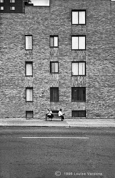 Passing By Two Seated Women