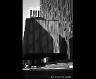 Man Smoking Sitting Around a Building