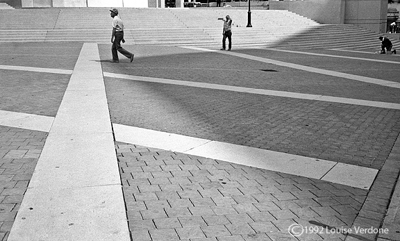 Three Men Around a Building