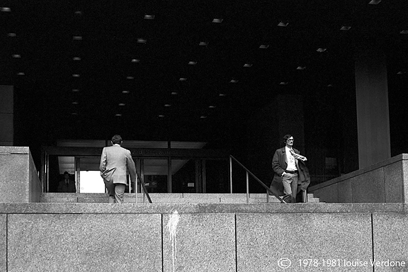 Two Men Around a Building