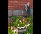 Waiter Figurine and Recycled Tire Flower Pot