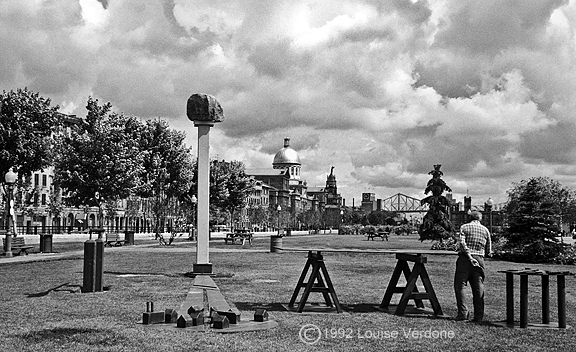 Man and Sculptures in a Park