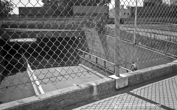 Caged Overpass and Cyclist