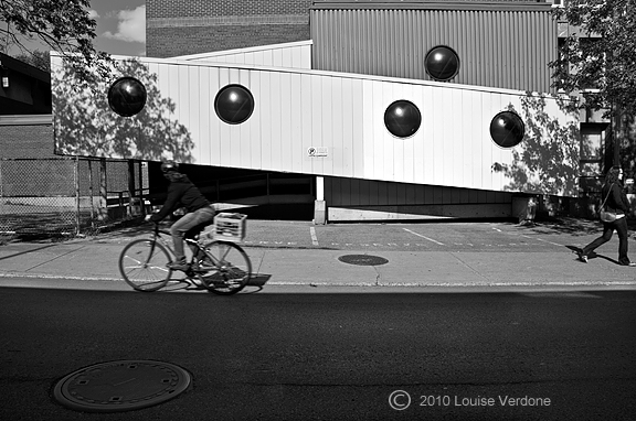 Cyclist and Black Circles in the Light