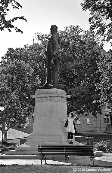 Standing Near a Sculpture